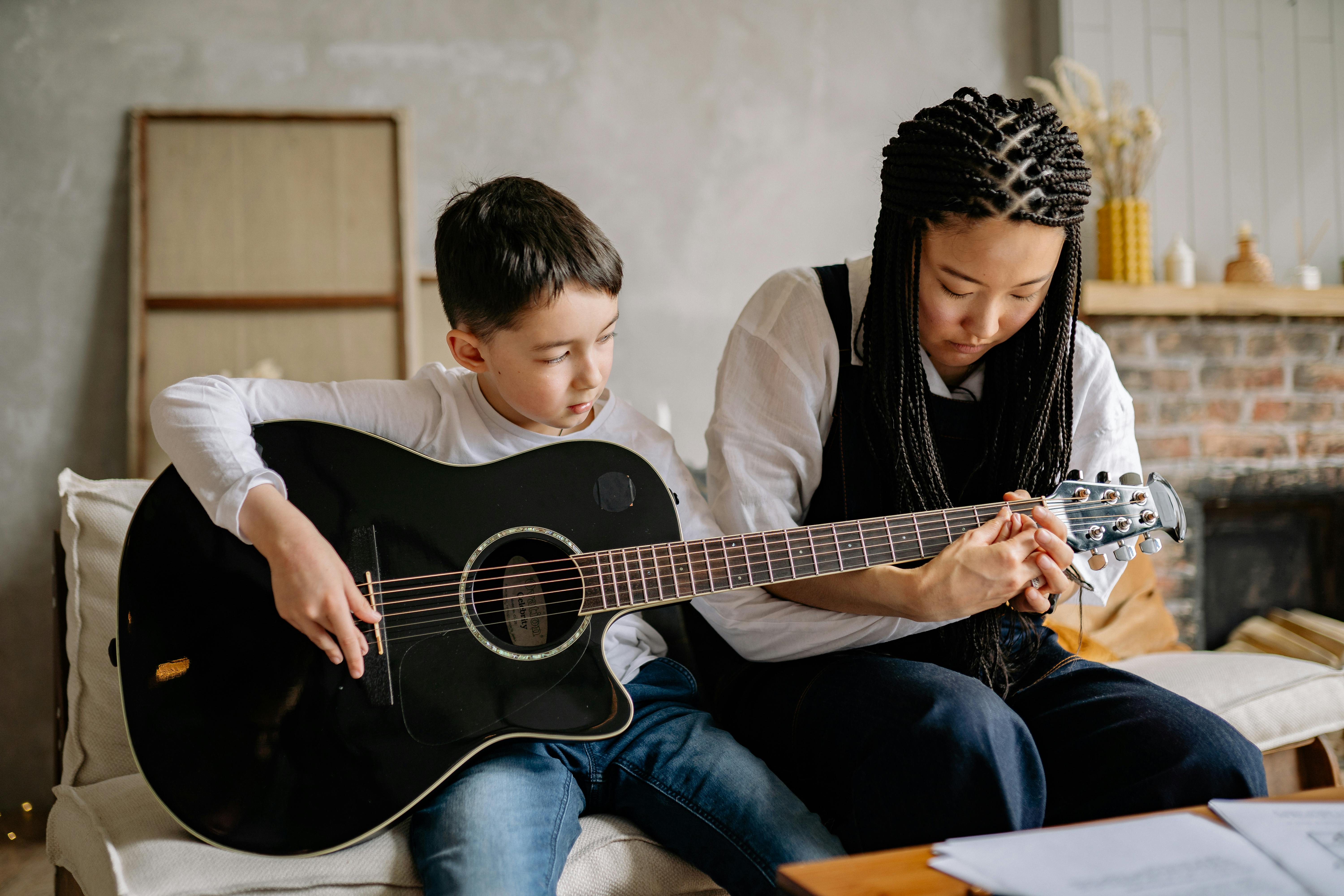 student playing guitar